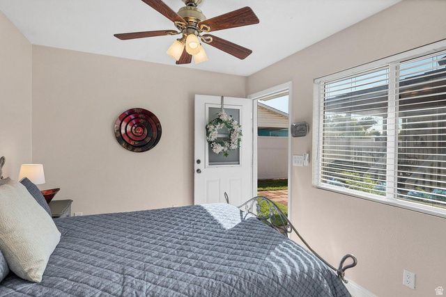 2990 East Riverside Drive, Unit 173 St. George, UT 84790 - Photo 25 of 38 Interior room featuring a ceiling fan with integrated lighting, a multi-pane window with blinds, and direct access to an exterior area
