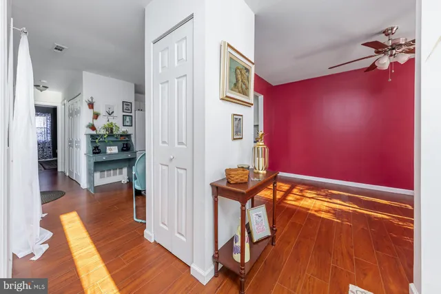 a view of a livingroom with furniture and hardwood floor