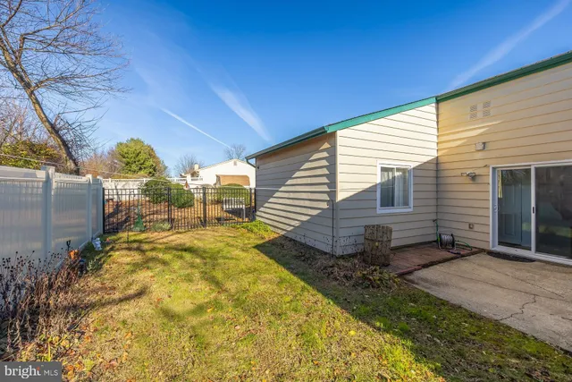 a view of a backyard with sitting area