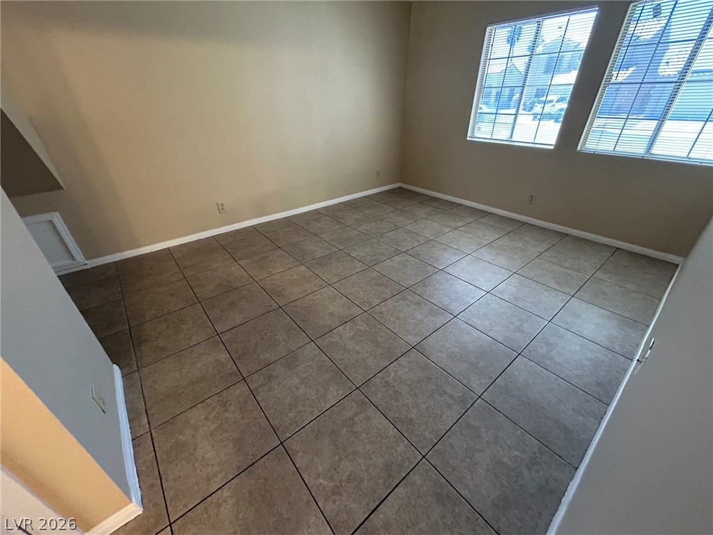 2806 Rungsted Street Las Vegas, NV 89142 - Photo 12 of 18 A well-lit, versatile space features durable tile flooring and natural light from ample windows.
