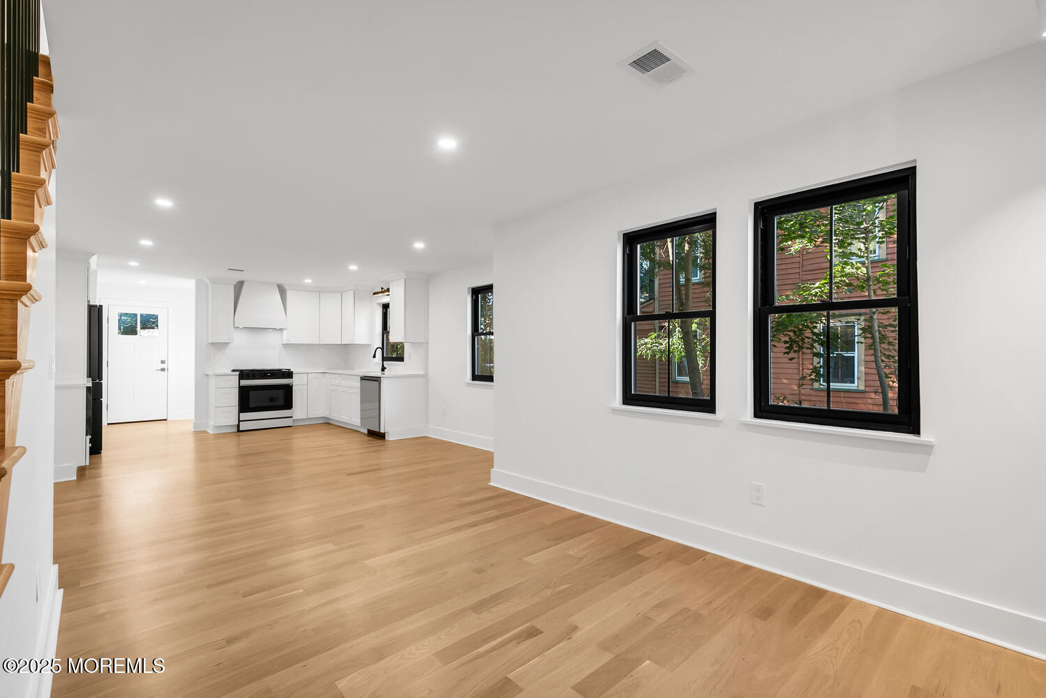 516 River Road Fair Haven, NJ 07704 - Photo 12 of 62 a view of an empty room with window and wooden floor