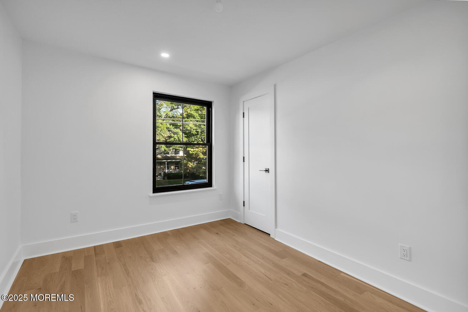 516 River Road Fair Haven, NJ 07704 - Photo 14 of 62 a view of an empty room with wooden floor and a window