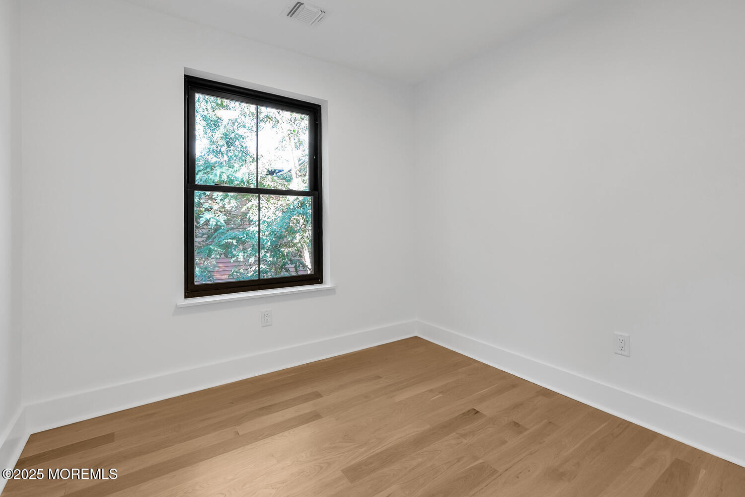 516 River Road Fair Haven, NJ 07704 - Photo 16 of 62 an empty room with wooden floor and windows