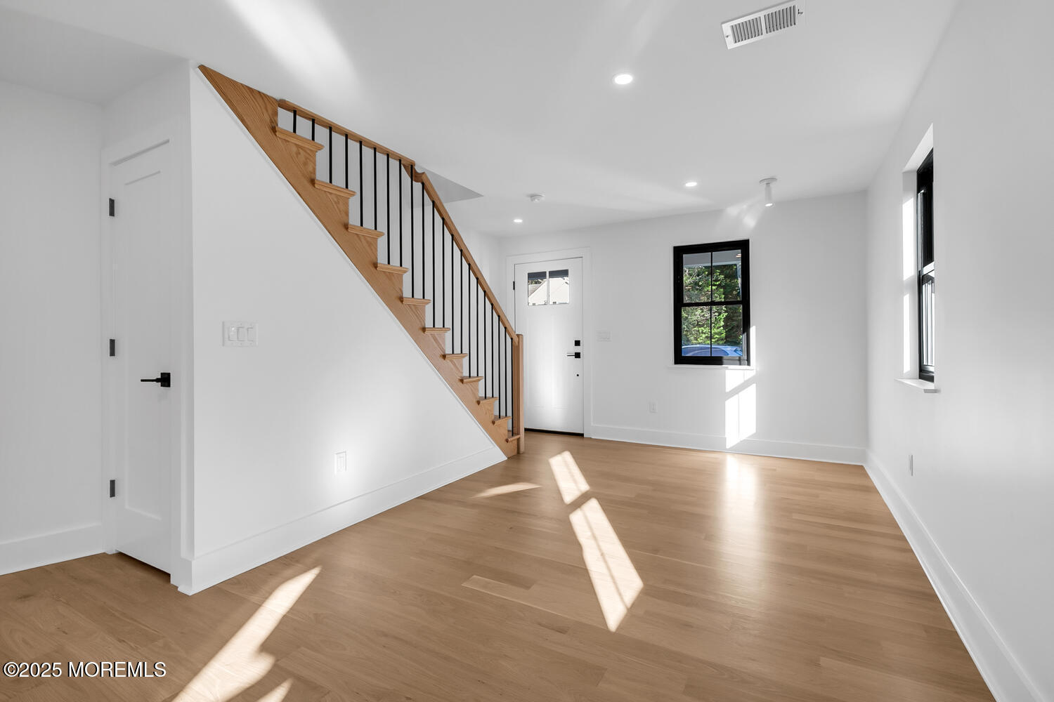 516 River Road Fair Haven, NJ 07704 - Photo 23 of 62 a view of a hallway with wooden floor and staircase