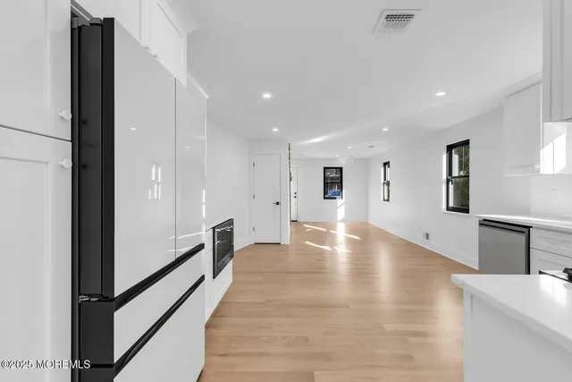 a stove top oven sitting inside of a kitchen