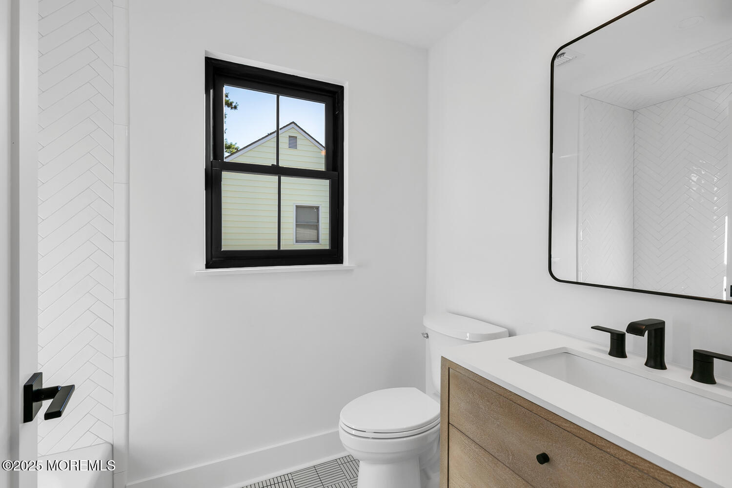 516 River Road Fair Haven, NJ 07704 - Photo 39 of 62 a bathroom with a granite countertop toilet a sink a mirror and a window