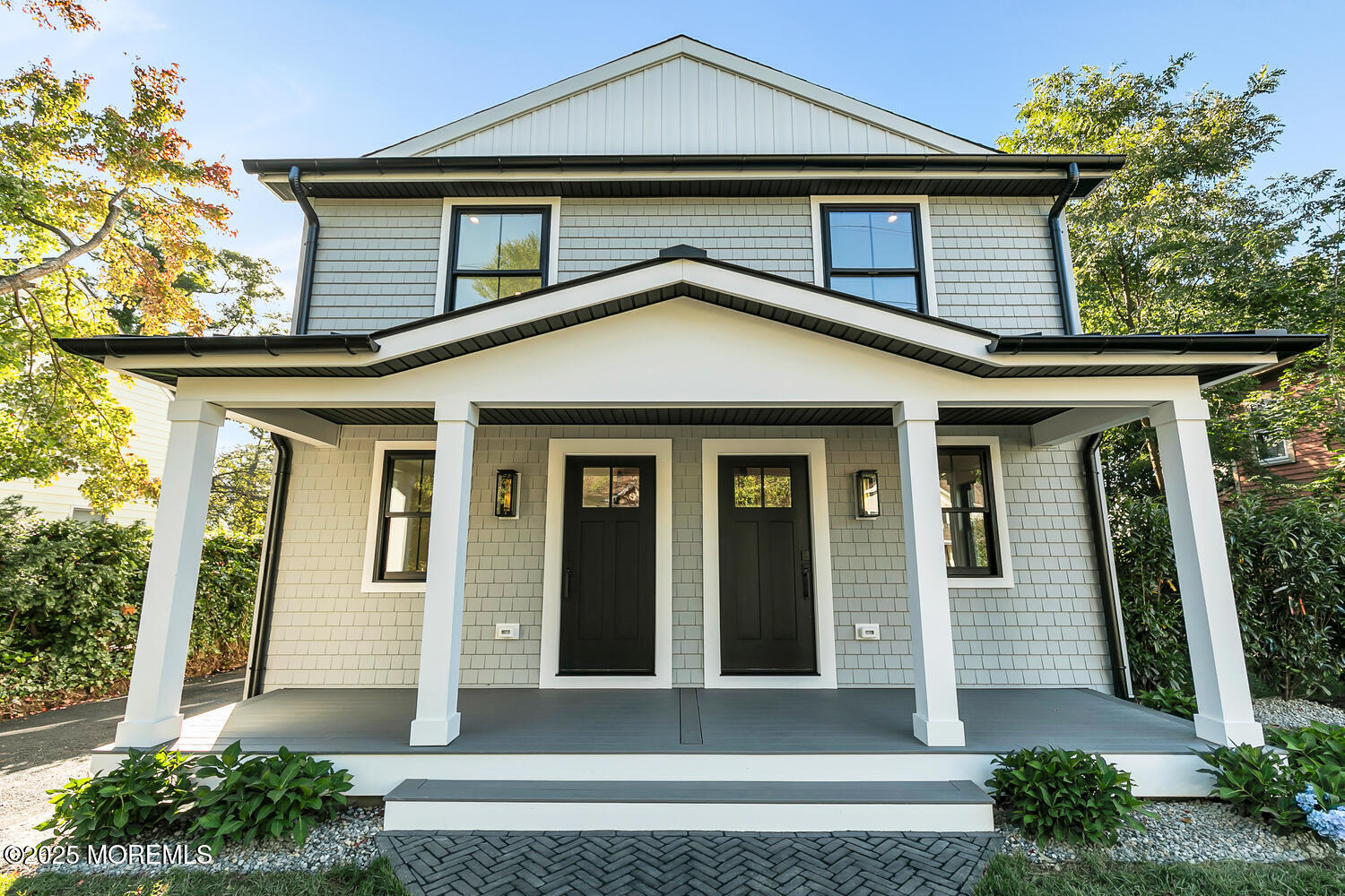 516 River Road Fair Haven, NJ 07704 - Photo 46 of 62 a front view of a house with a garden