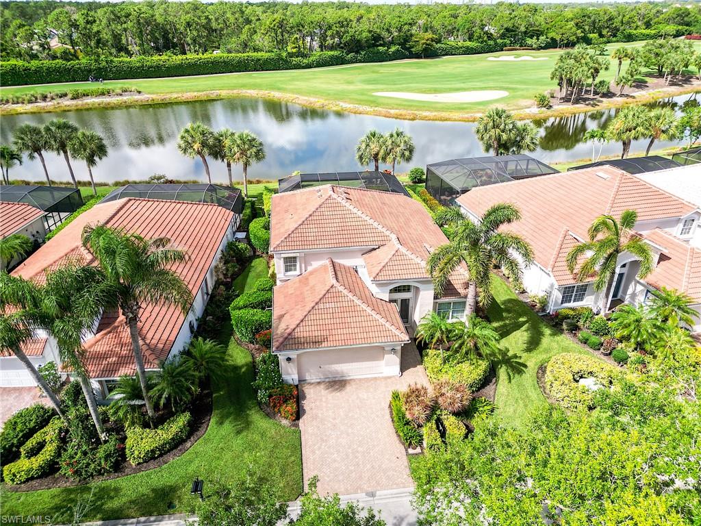9156 Spring Run Boulevard Estero, FL 34135 - Photo 32 of 34 a view of lake from balcony with outdoor space and lake view