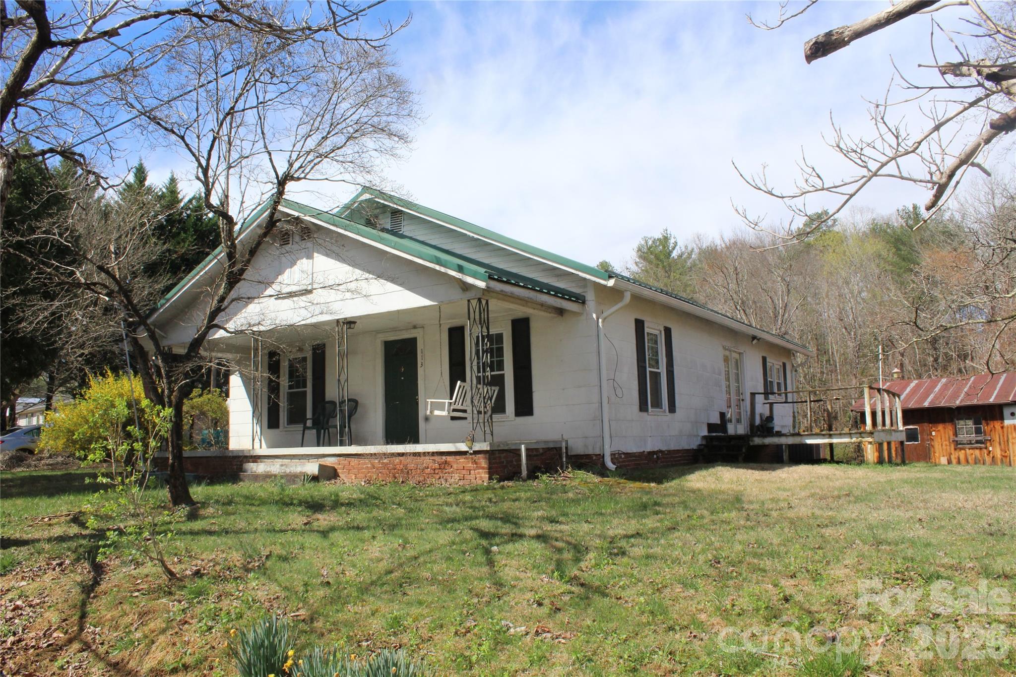 front view of a house with a yard