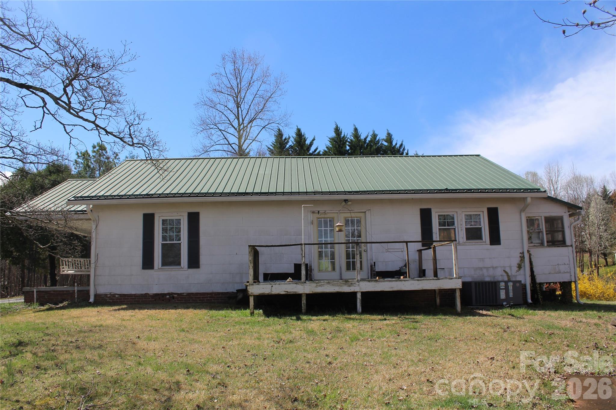 113 Williams Street Morganton, NC 28655 - Photo 11 of 20 a view of a house with a yard and sitting area