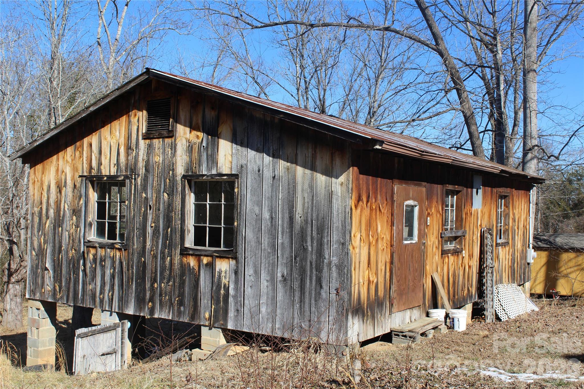 113 Williams Street Morganton, NC 28655 - Photo 20 of 20 a view of a house with backyard and wooden fence