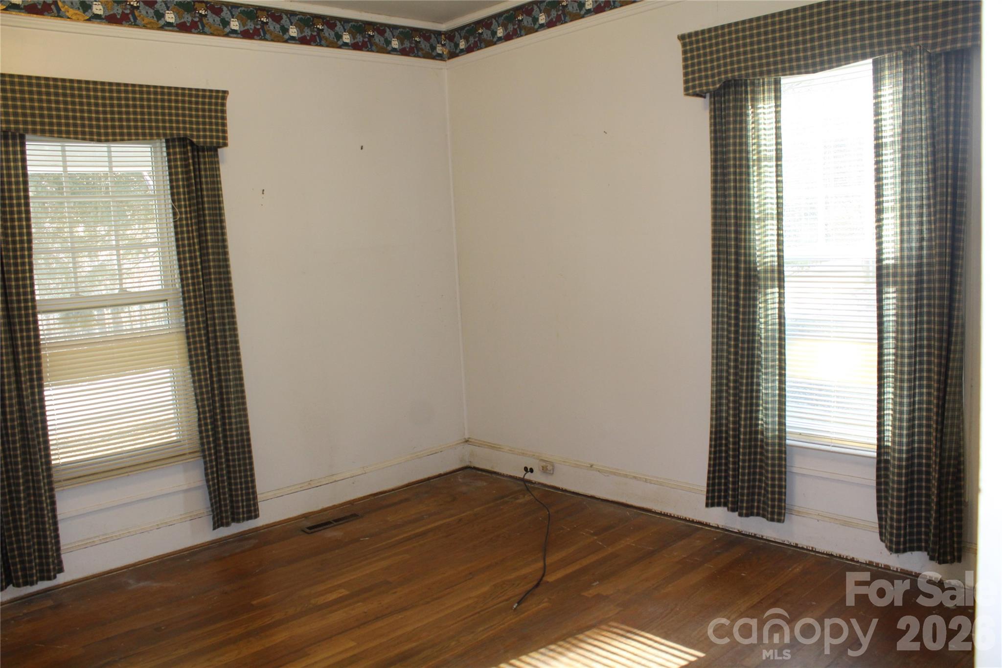 113 Williams Street Morganton, NC 28655 - Photo 4 of 20 a view of an empty room and window