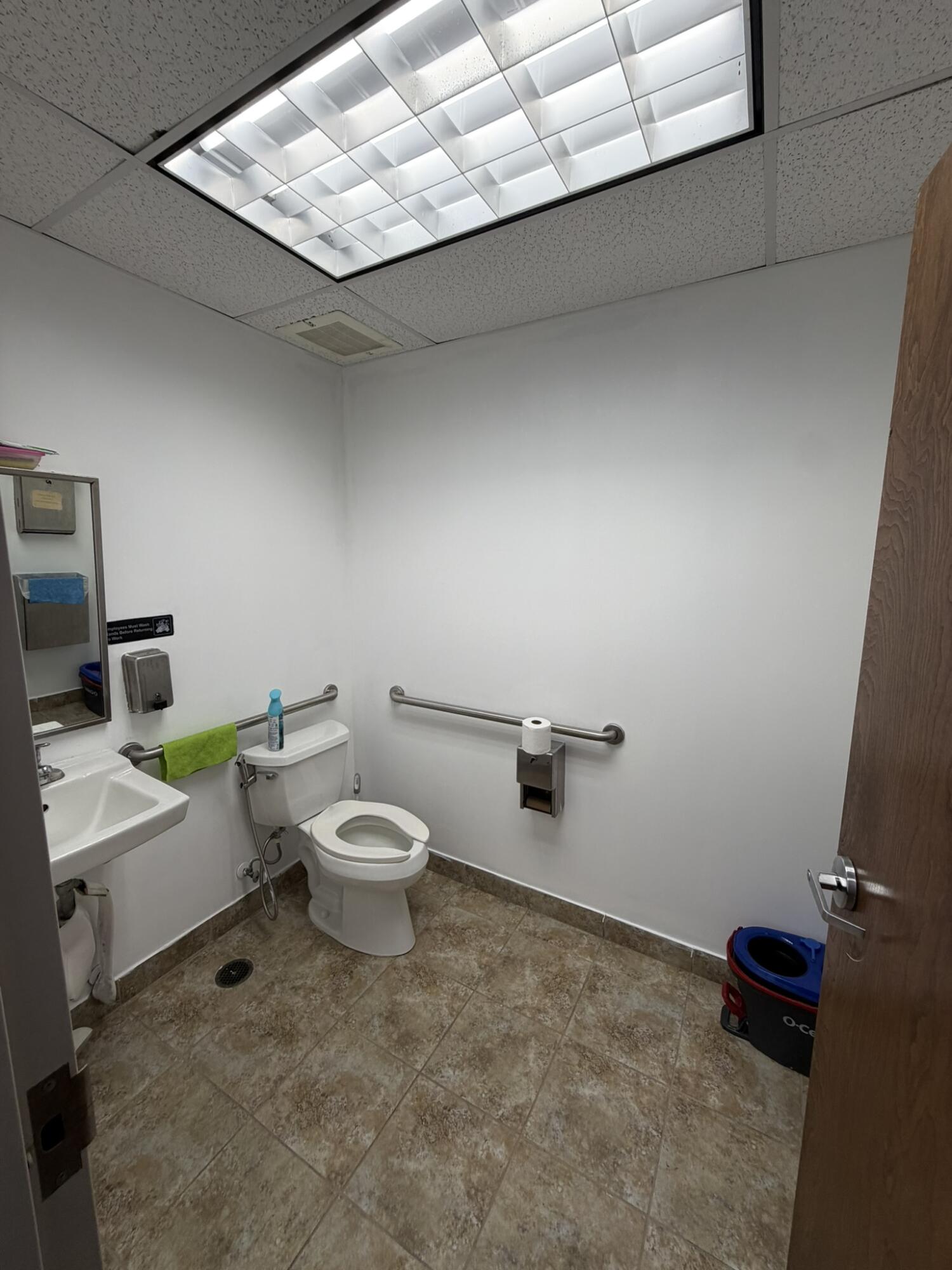 1779 Banks Road, Unit 17791781 Margate, FL 33063 - Photo 7 of 10 a white toilet sitting next to a bathroom sink