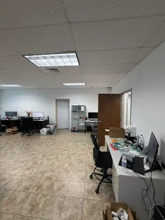 a view of a workspace with furniture