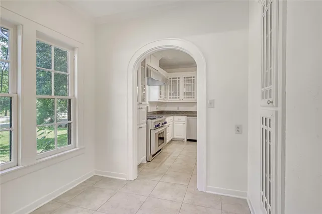 a view of a kitchen with fridge and sink