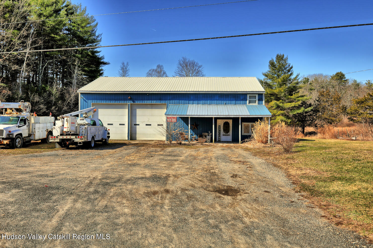 301 Sugar Loaf Road Earlton, NY 12058 - Photo 45 of 64 a front view of a house with a yard and garage