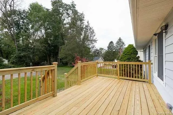 a deck with trees in front of it