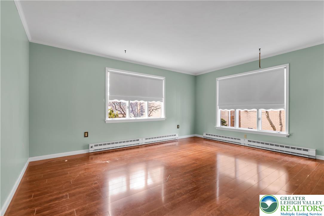 589 North Main Street Luzerne County, PA 18705 - Photo 16 of 53 an empty room with wooden floor and windows