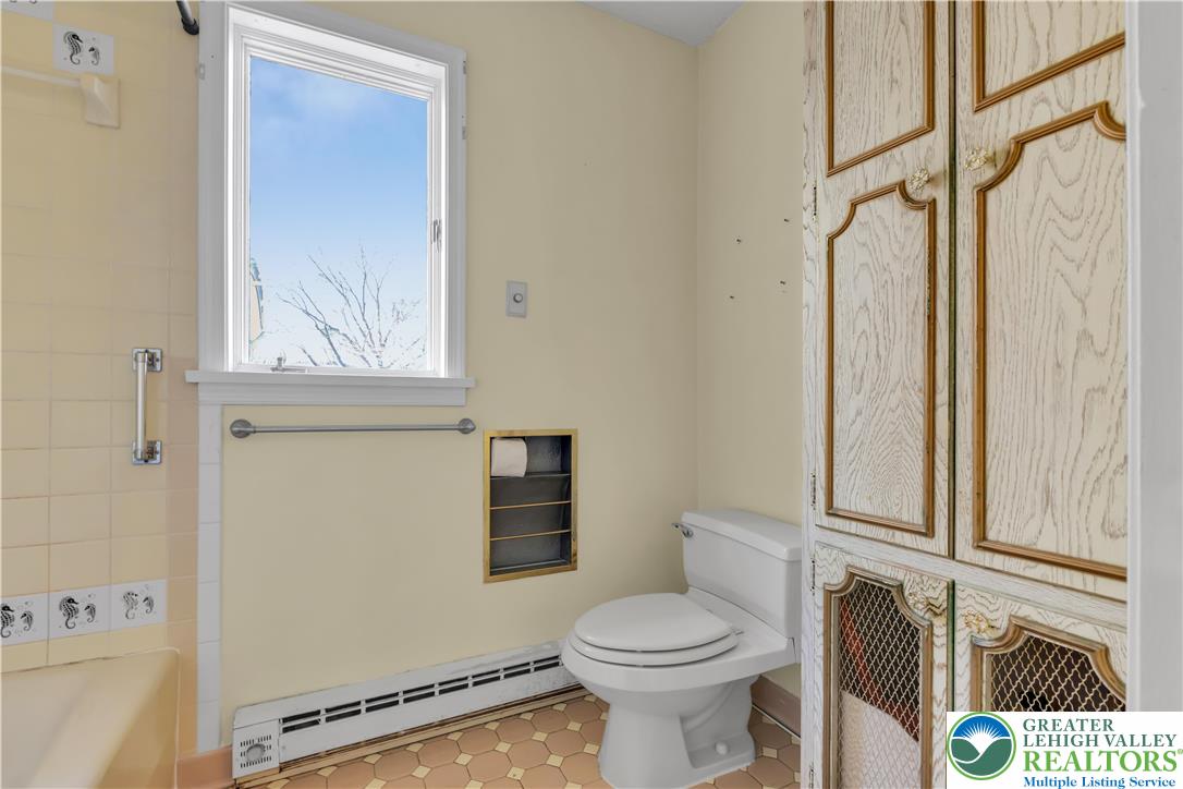 589 North Main Street Luzerne County, PA 18705 - Photo 22 of 53 a bathroom with a toilet a sink and a window