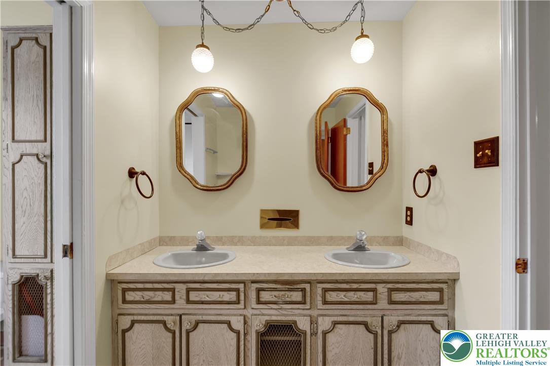 589 North Main Street Luzerne County, PA 18705 - Photo 23 of 53 a bathroom with a granite countertop double vanity sink and a mirror