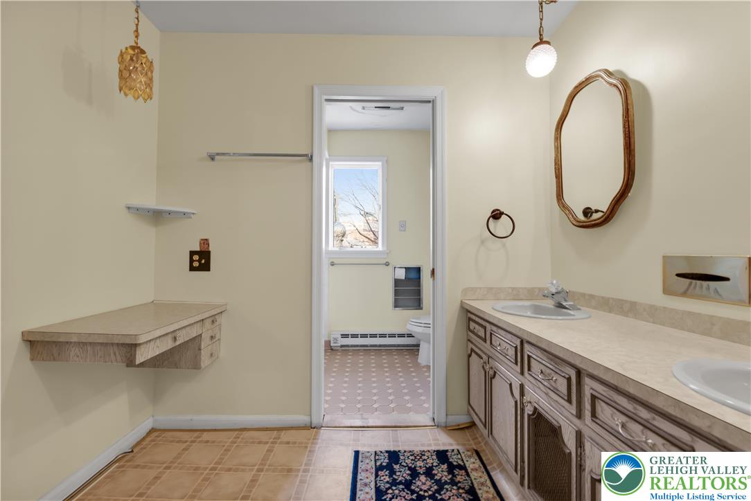 589 North Main Street Luzerne County, PA 18705 - Photo 24 of 53 a bathroom with a sink a vanity and a mirror