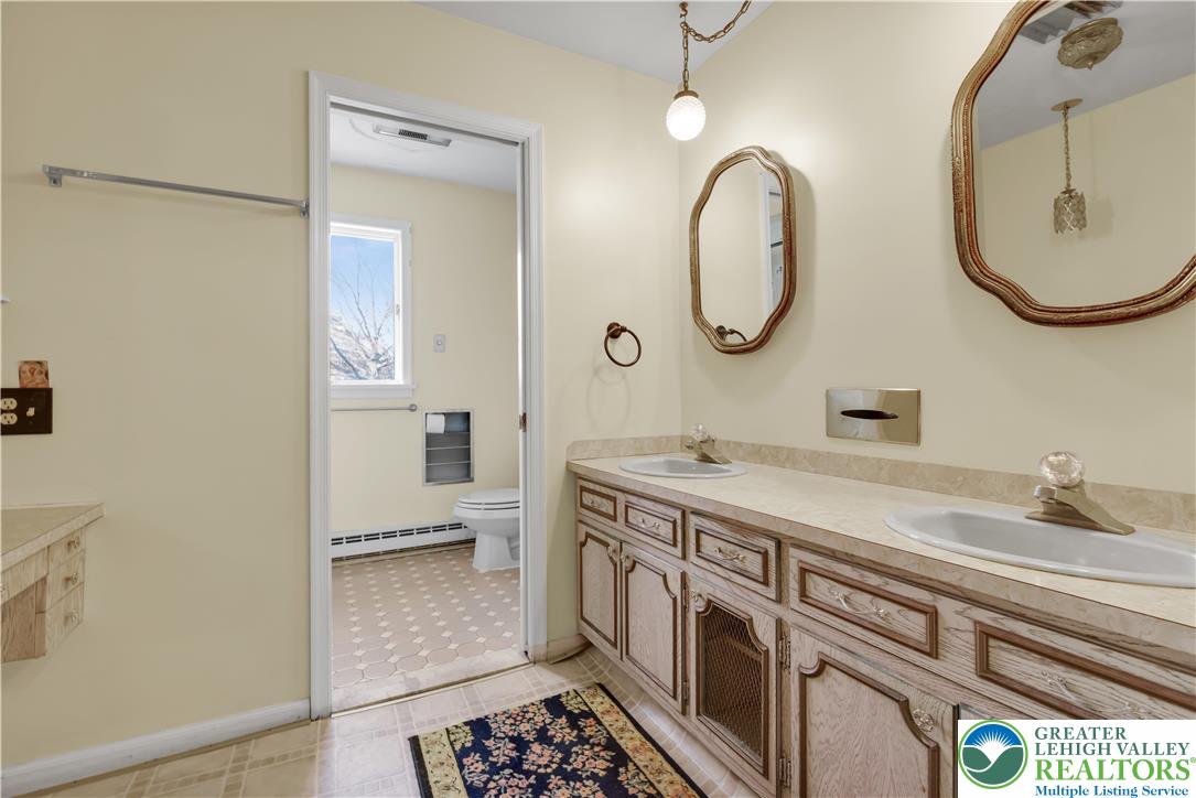 589 North Main Street Luzerne County, PA 18705 - Photo 25 of 53 a spacious bathroom with a double vanity sink and a mirror