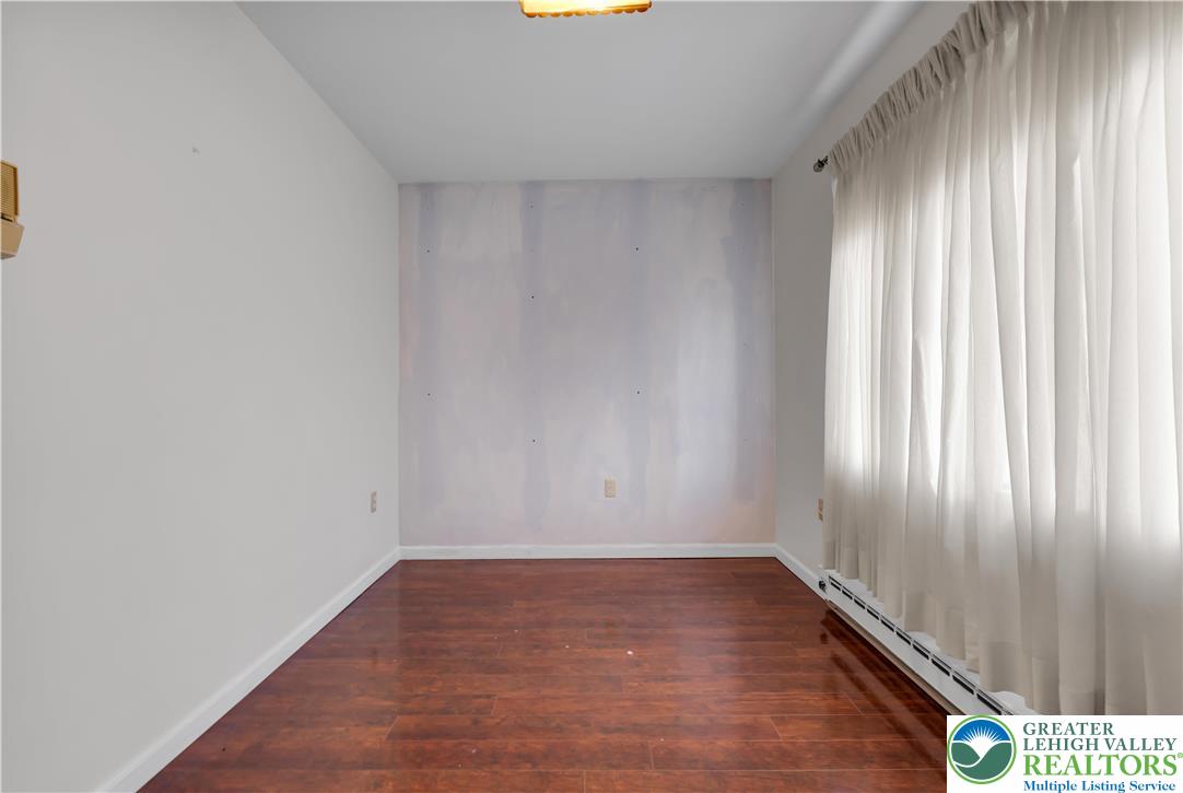 589 North Main Street Luzerne County, PA 18705 - Photo 26 of 53 a view of an empty room with wooden floor and a window