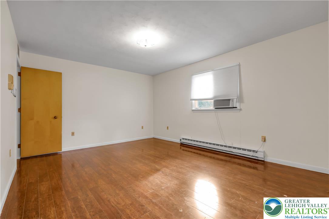 589 North Main Street Luzerne County, PA 18705 - Photo 29 of 53 an empty room with wooden floor and windows