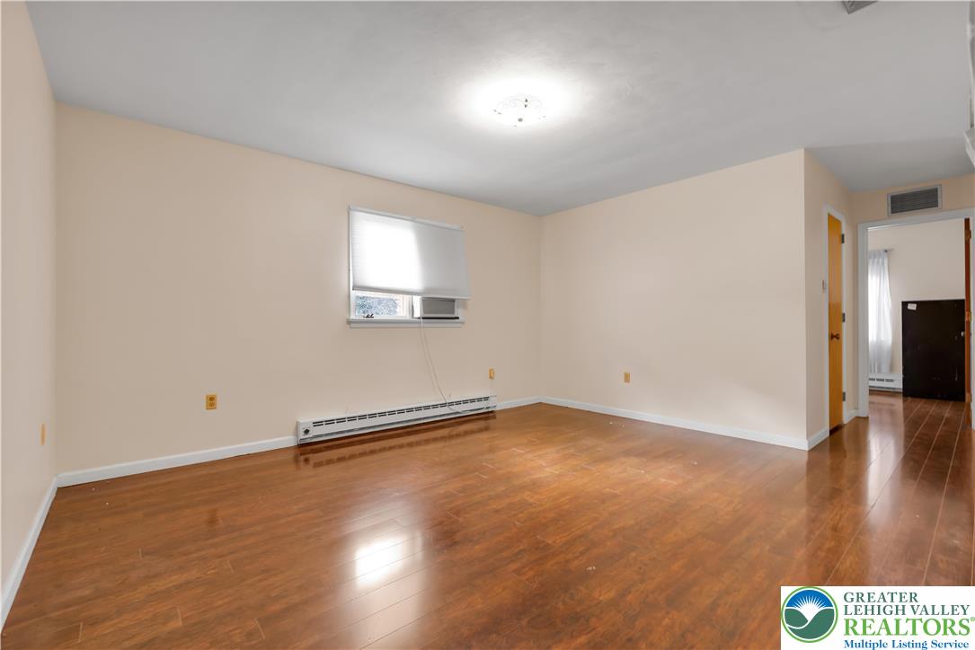 589 North Main Street Luzerne County, PA 18705 - Photo 31 of 53 an empty room with wooden floor and windows