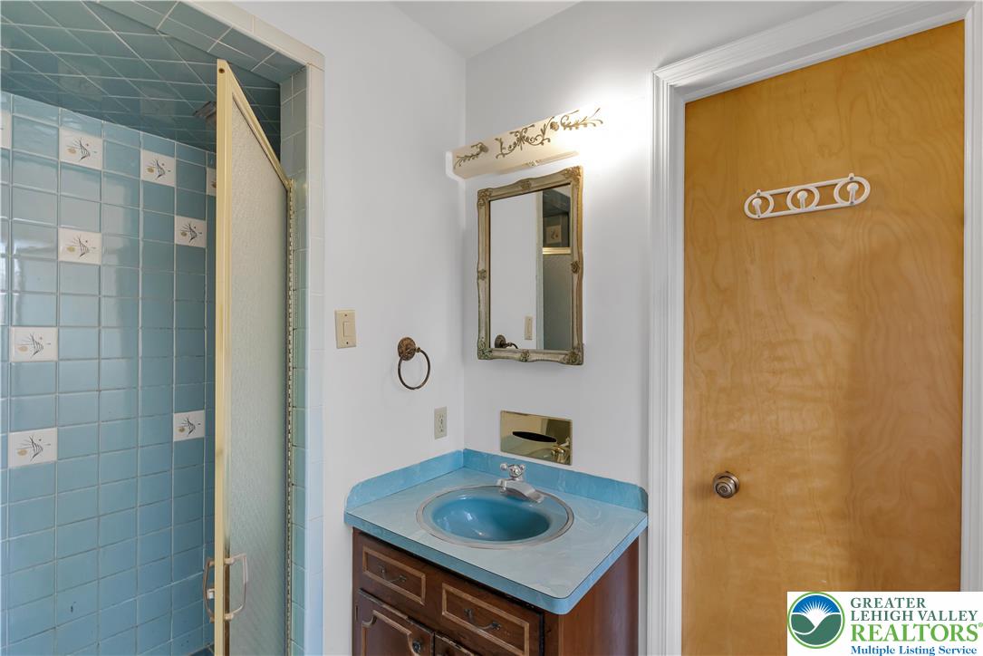 589 North Main Street Luzerne County, PA 18705 - Photo 34 of 53 a bathroom with a sink and a mirror