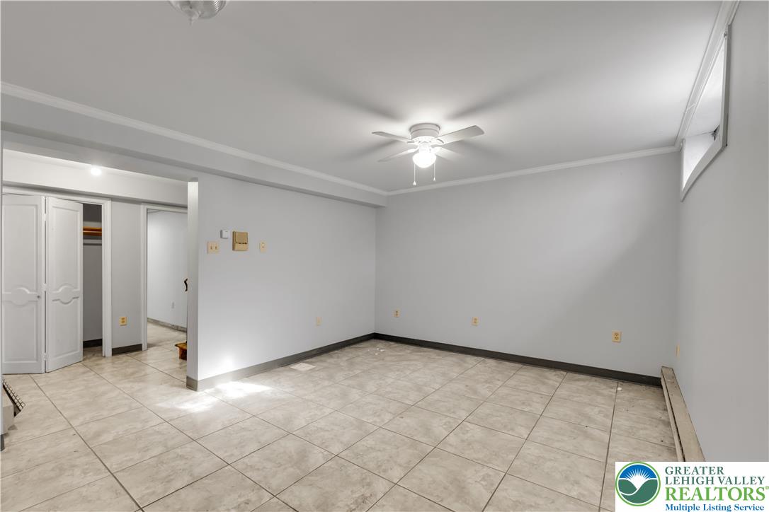 589 North Main Street Luzerne County, PA 18705 - Photo 47 of 53 an empty room with a ceiling fan and glass door