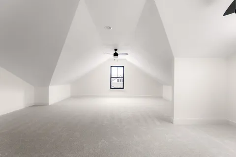 a view of a big room with windows and cabinet