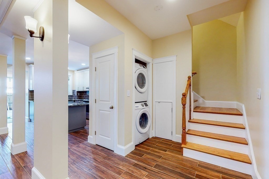 9 Wallingford Road Boston, MA 02135 - Photo 11 of 22 a view of a hallway with closet and wooden floor