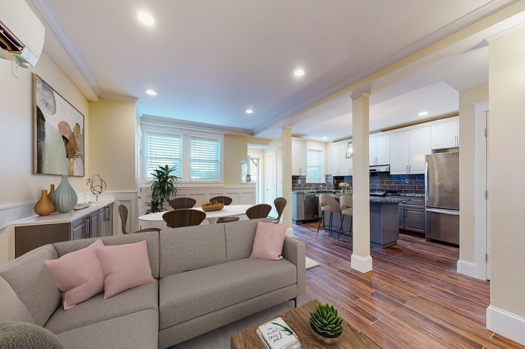9 Wallingford Road Boston, MA 02135 - Photo 3 of 22 a living room with furniture kitchen view and a wooden floor