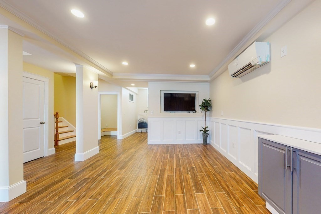 9 Wallingford Road Boston, MA 02135 - Photo 7 of 22 a view of a livingroom with wooden floor