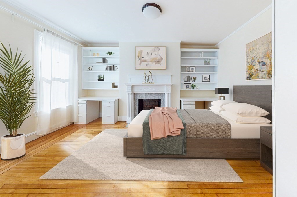 9 Wallingford Road Boston, MA 02135 - Photo 8 of 22 a living room with furniture and a fireplace