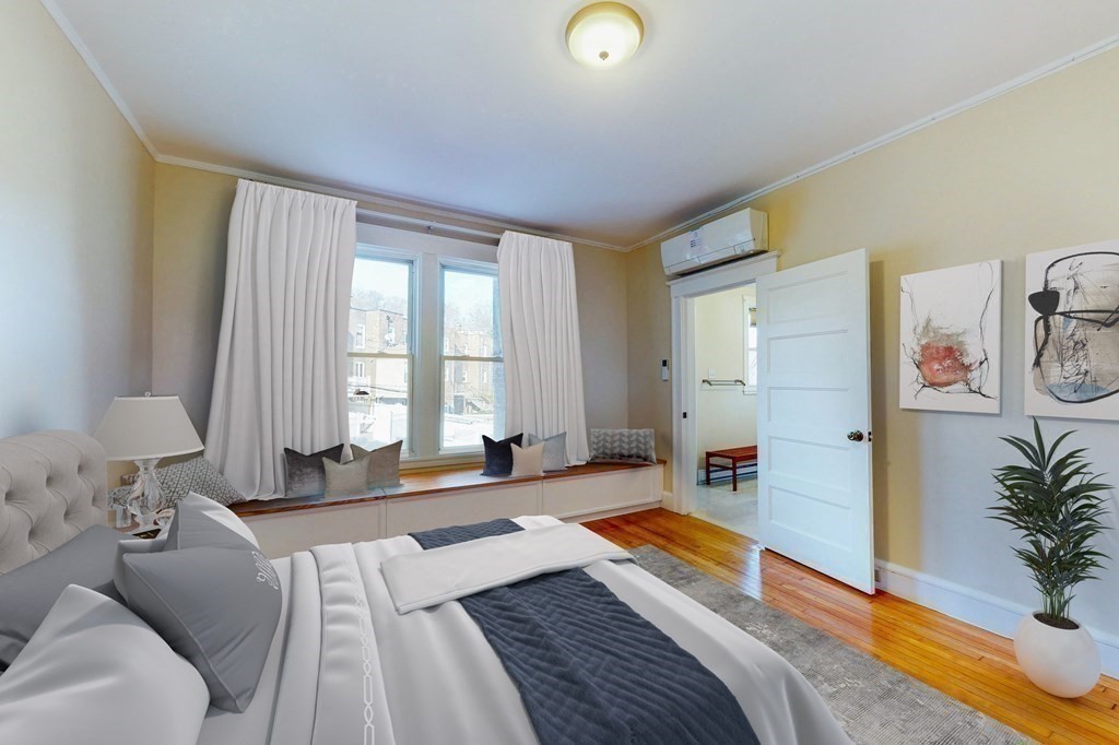 9 Wallingford Road Boston, MA 02135 - Photo 9 of 22 a bedroom with a bed and a window