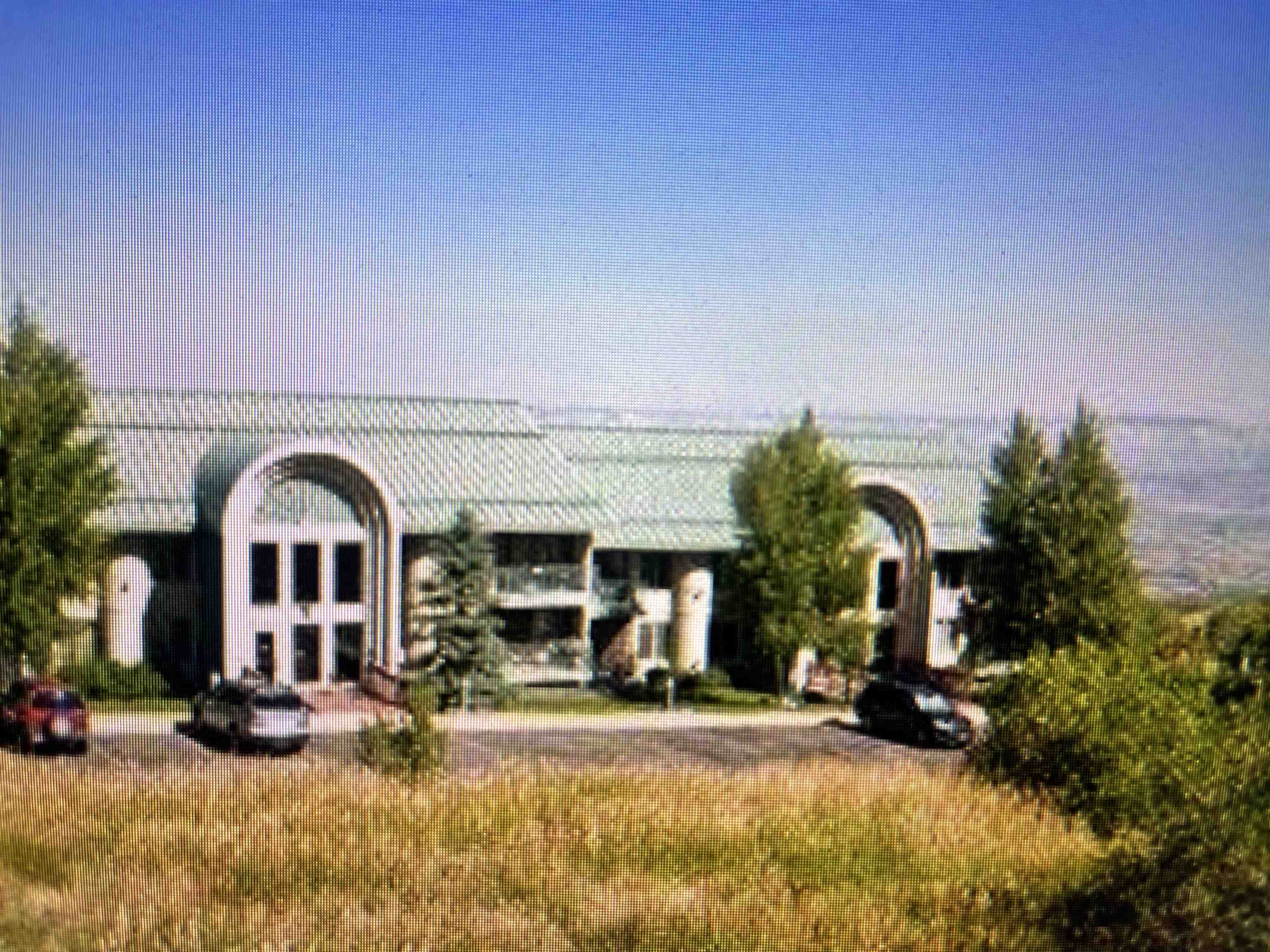 a view of a building with a yard