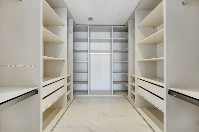 a view of an empty walk in closet