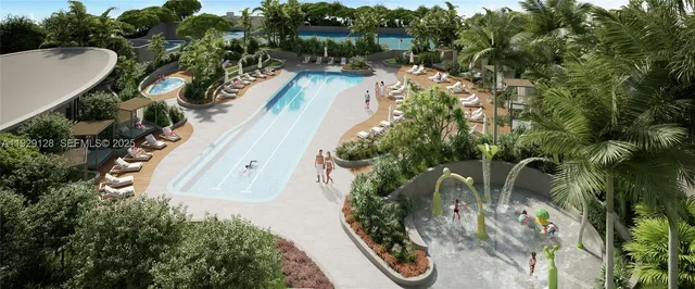 a view of a patio with couches and table and chairs under an umbrella