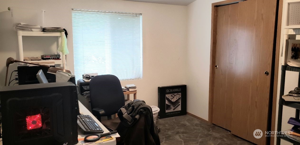 520 Willow Drive, Unit 111 Enumclaw, WA 98022 - Photo 12 of 26 a living room with furniture and a flat screen tv