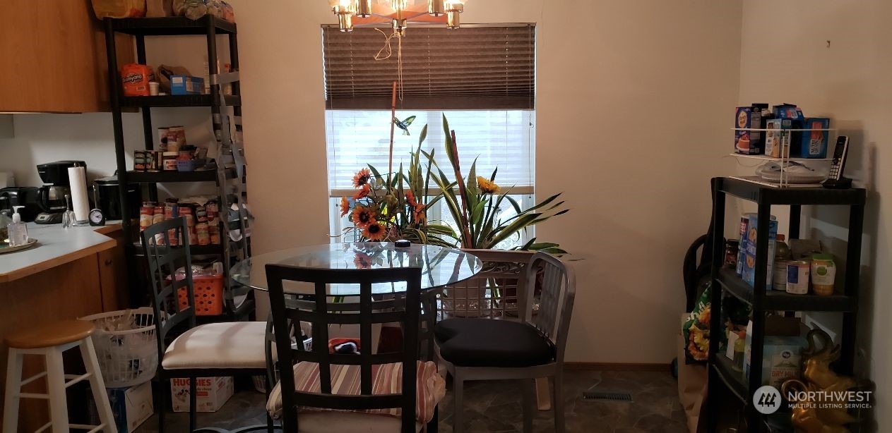 520 Willow Drive, Unit 111 Enumclaw, WA 98022 - Photo 6 of 26 a view of a dining room with furniture and window