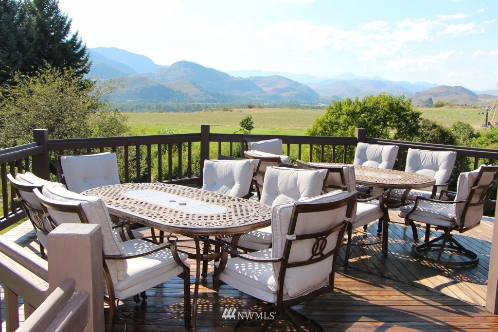 80 Tice Ranch Road Twisp, WA 98856 - Photo 4 of 22 a view of a chairs and table on the terrace