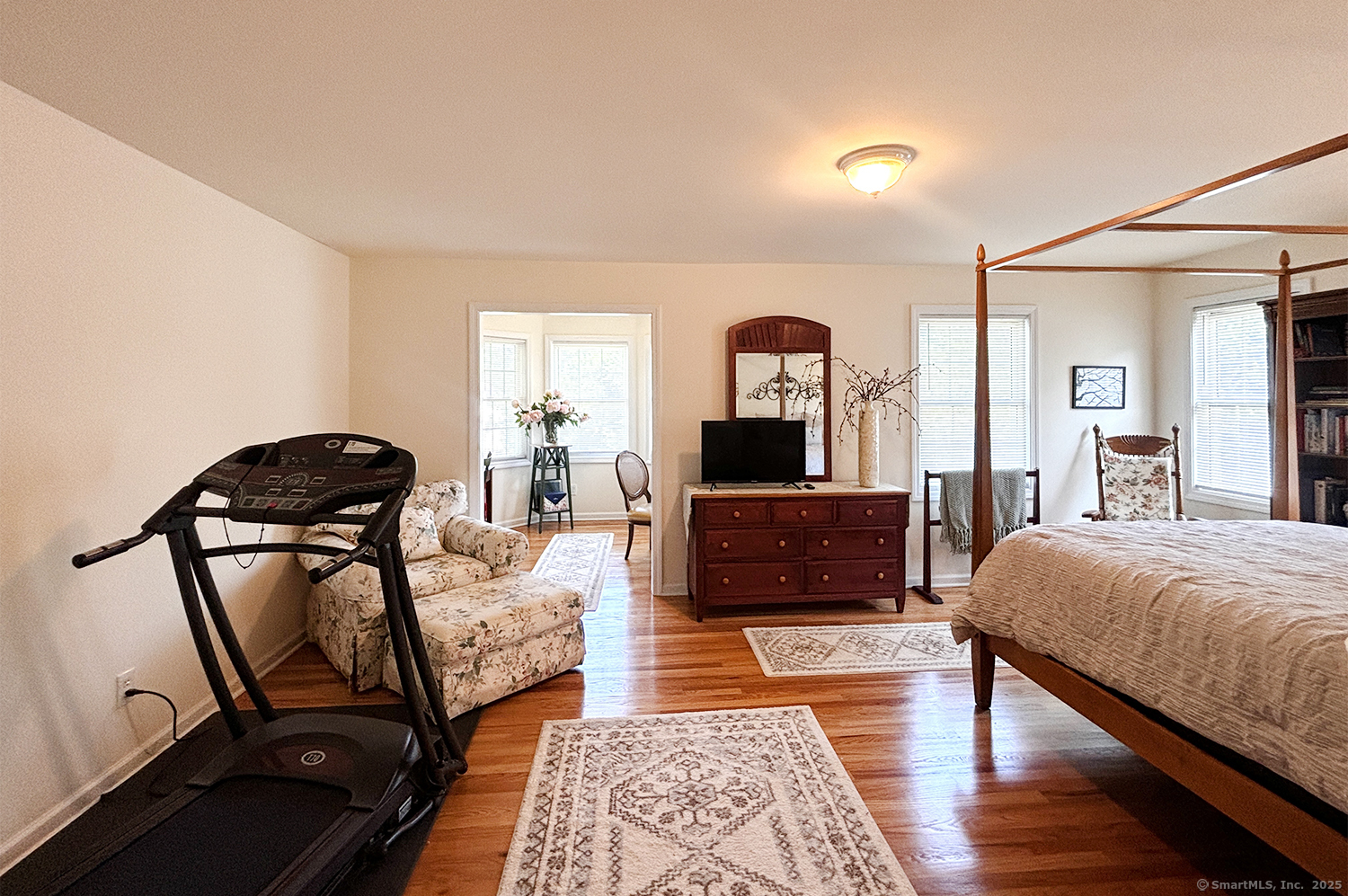 391 South Pine Creek Road Fairfield, CT 06824 - Photo 13 of 25 a bedroom with furniture and a mirror