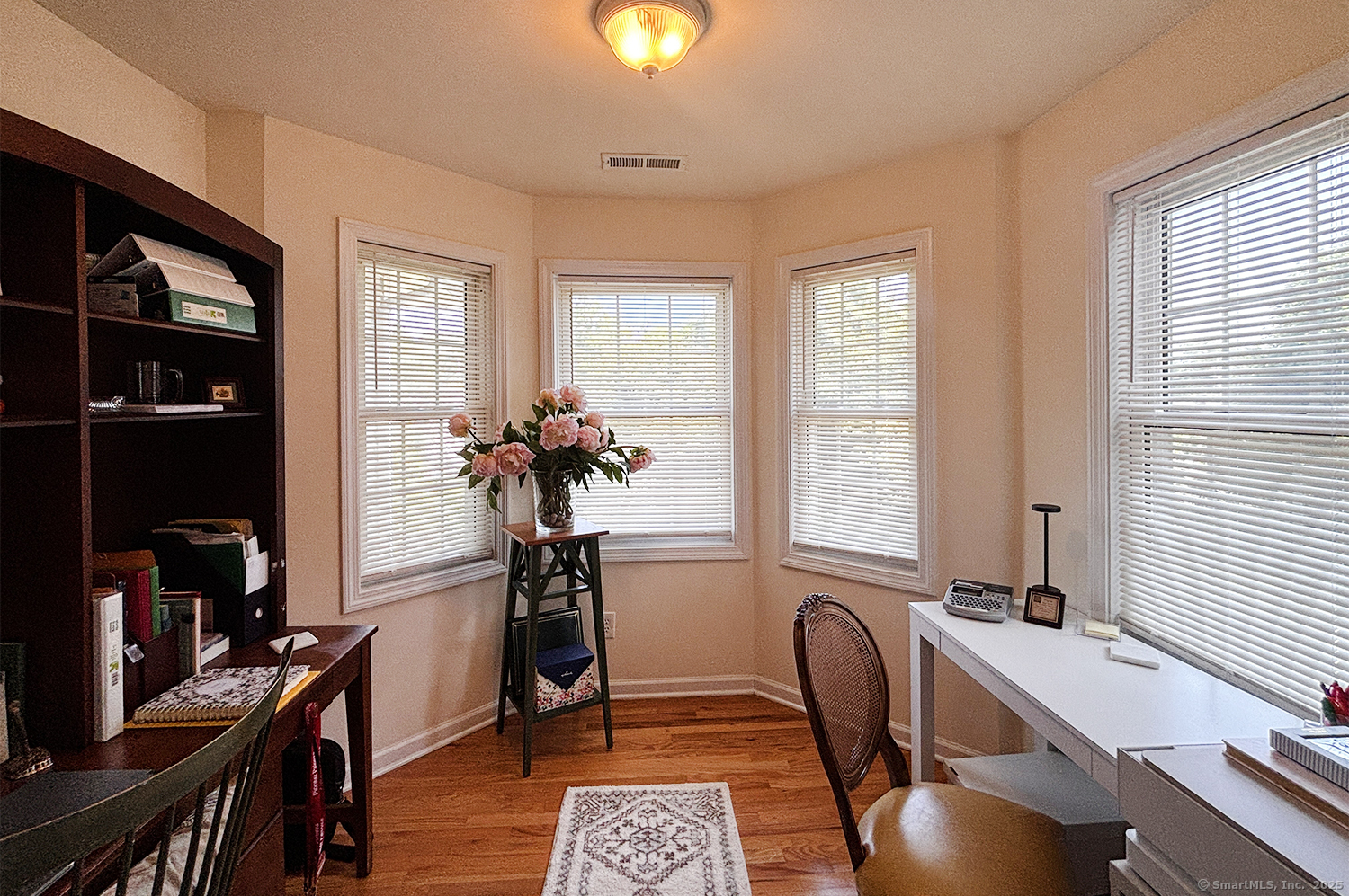391 South Pine Creek Road Fairfield, CT 06824 - Photo 15 of 25 a view of a workspace with furniture and a window