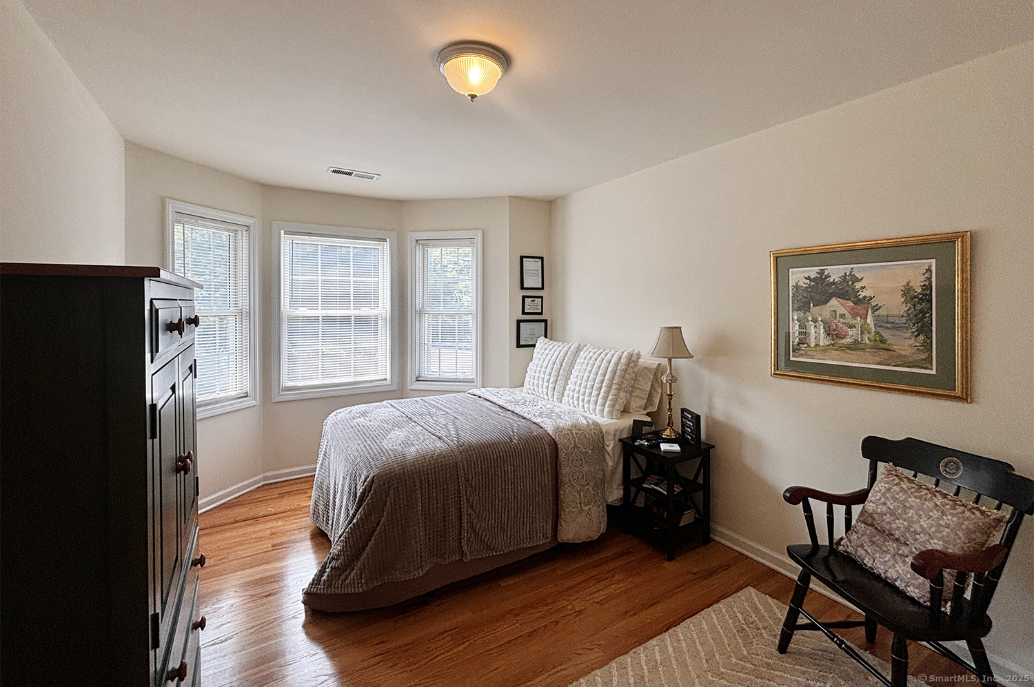 391 South Pine Creek Road Fairfield, CT 06824 - Photo 18 of 25 a bedroom with a bed and a window