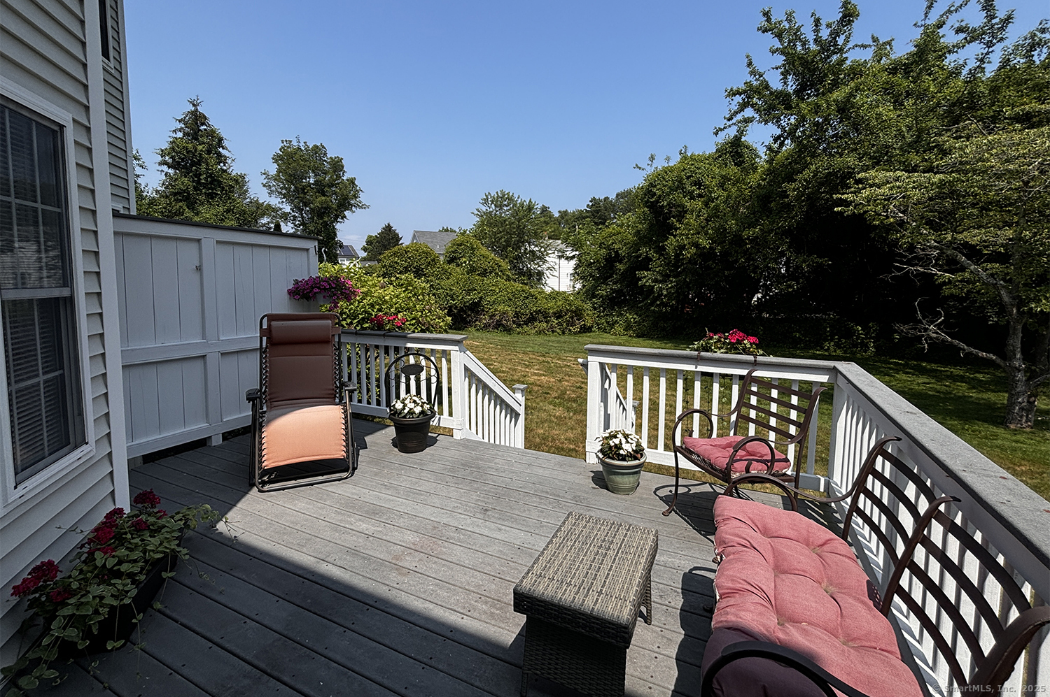 391 South Pine Creek Road Fairfield, CT 06824 - Photo 21 of 25 a balcony with wooden floor table and chairs
