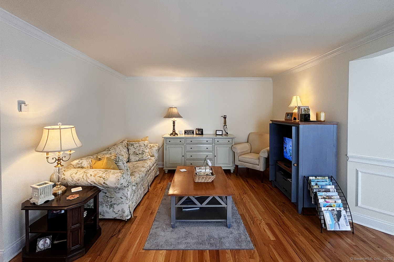 391 South Pine Creek Road Fairfield, CT 06824 - Photo 5 of 25 a living room with furniture and a wooden floor
