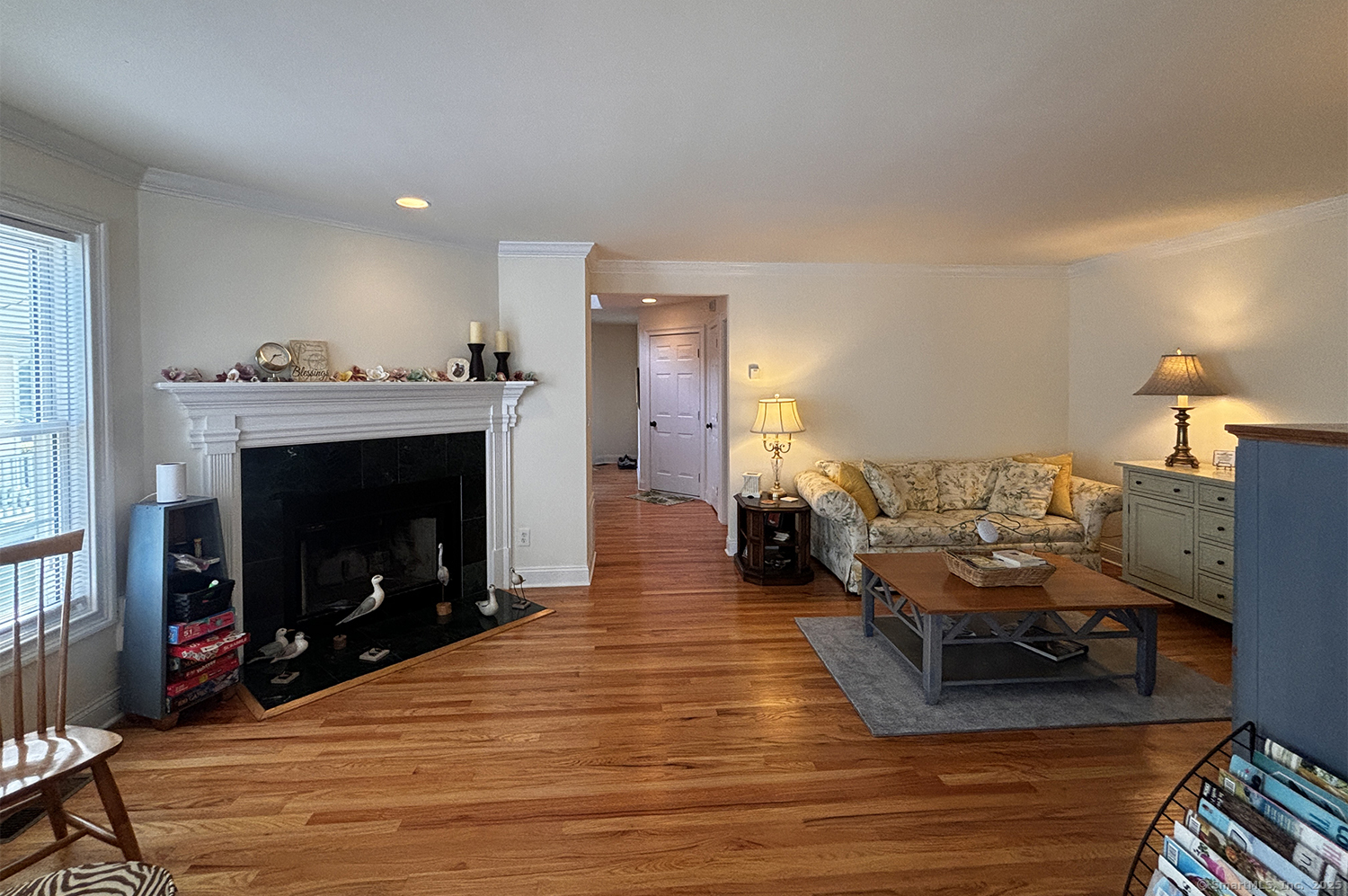 391 South Pine Creek Road Fairfield, CT 06824 - Photo 6 of 25 a living room with furniture and a fireplace