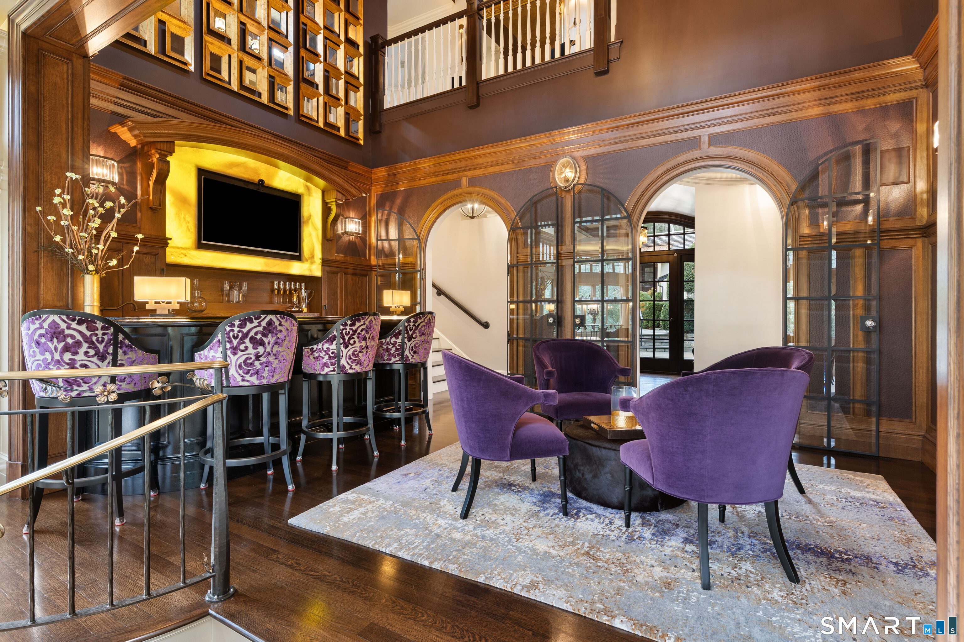 252 River Road Deep River, CT 06417 - Photo 14 of 40 Luxurious finish details include onyx-framed TV, arched beveled glass French doors, & faux embossed crocodile wall treatments.